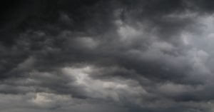 Family arriving at an indoor activity center during bad weather