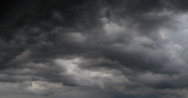Family arriving at an indoor activity center during bad weather