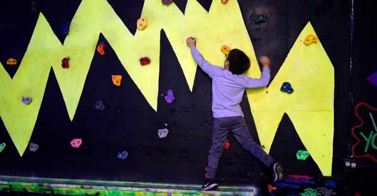 Kids actively playing during an indoor birthday party
