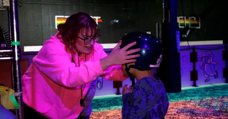 Birthday party host helping kids during a celebration