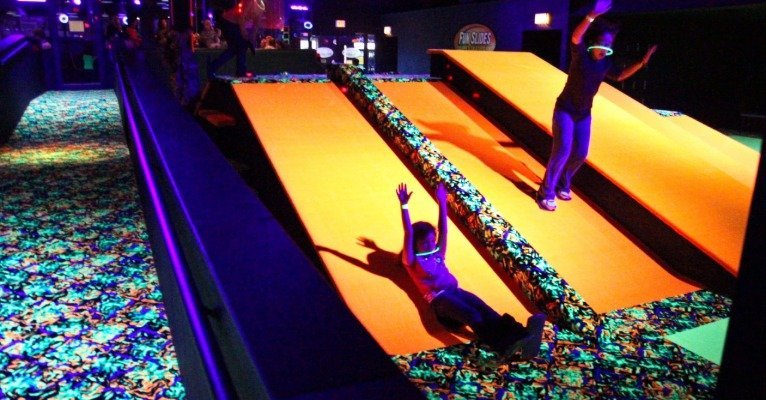 kids sliding down ramps at Fun Slides