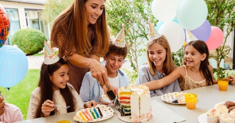 Birthday party host guiding kids through activities