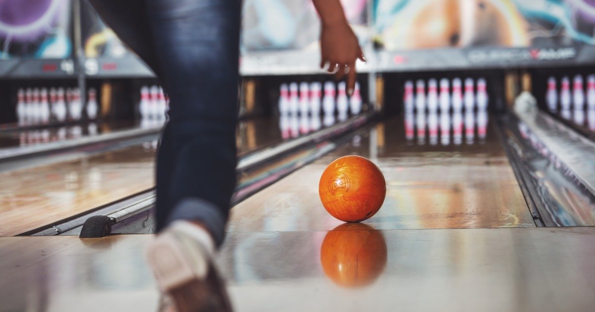 Family bowling together indoors