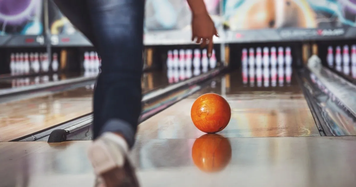 Family bowling together indoors