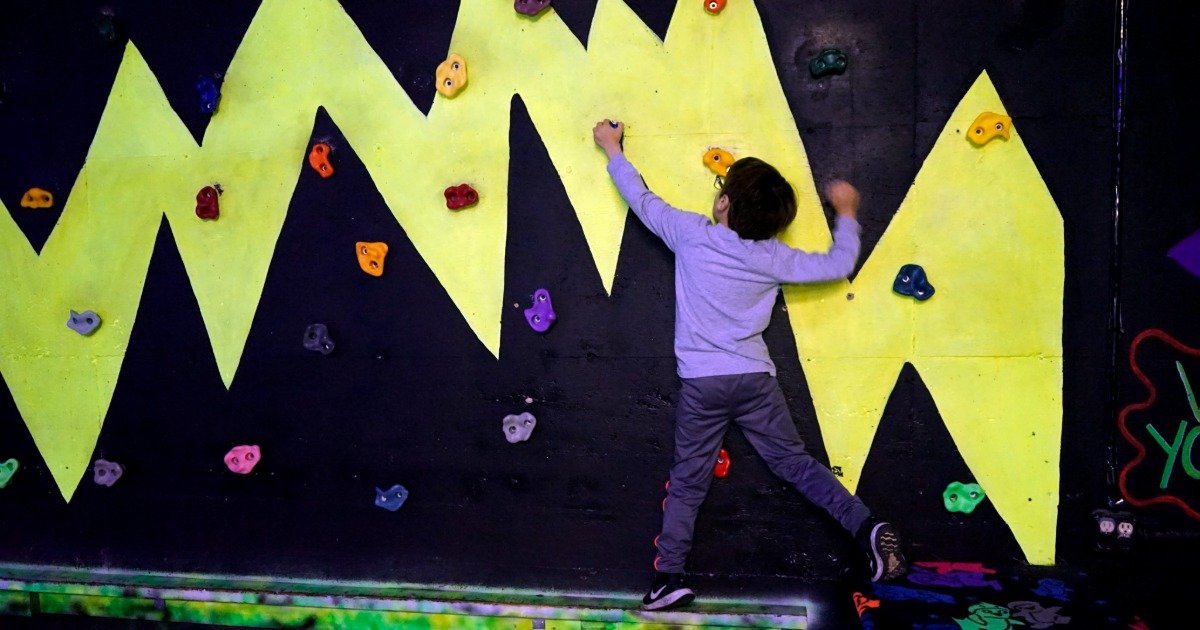 Kids climbing at an indoor climbing gym birthday party in Pittsburgh