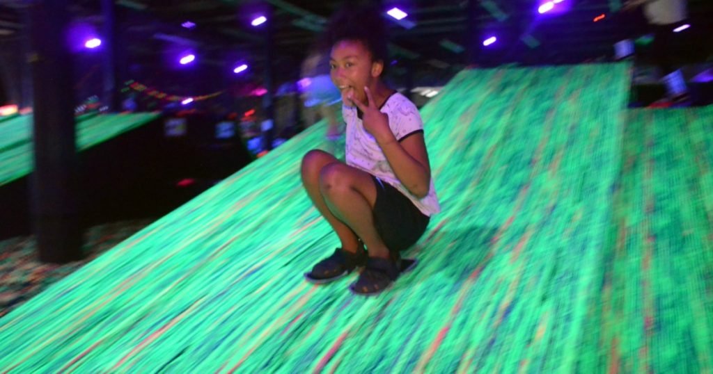 Kids enjoying indoor birthday party activities at an indoor entertainment venue in Pittsburgh