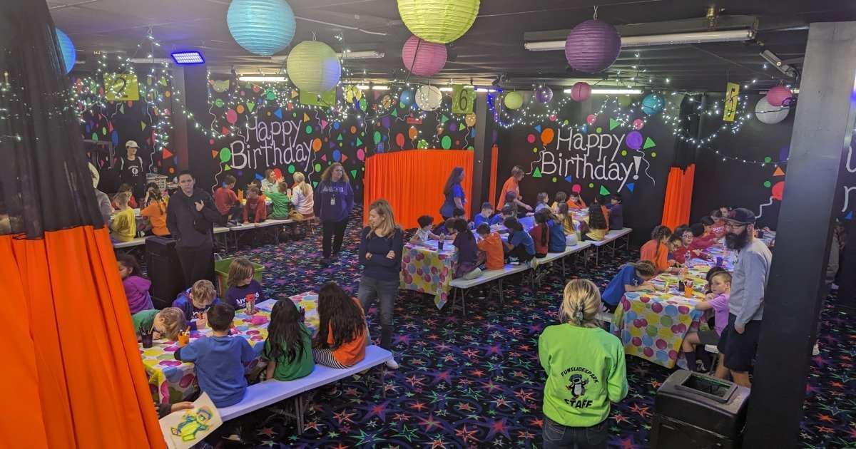 Kids having fun at an indoor kids birthday party venue with activities and open space