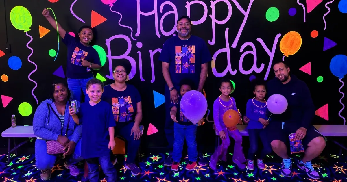 Kids celebrating a birthday party at an indoor blacklight party center in the North Hills