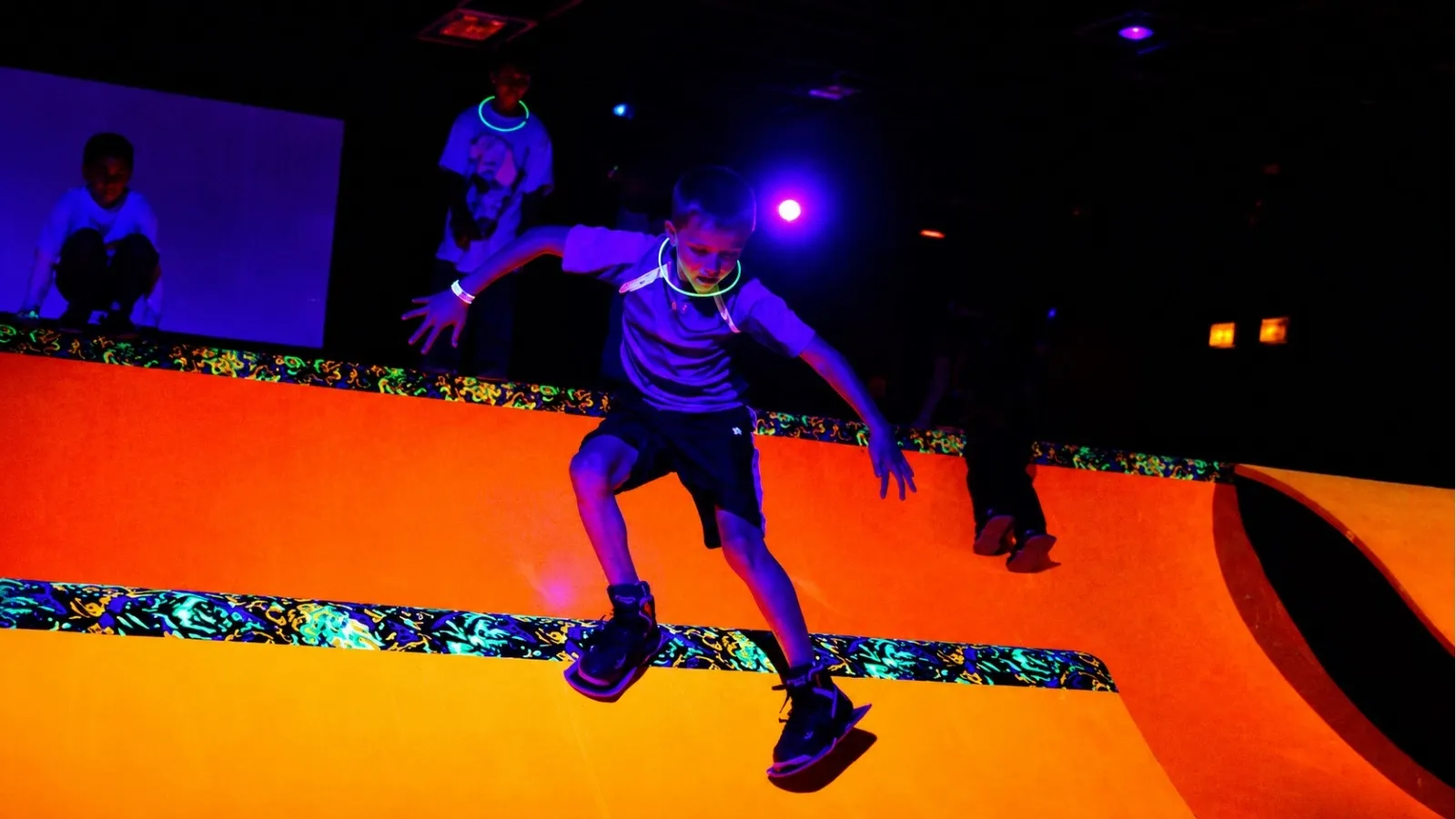 Fun Slides hours and prices — kids skating the carpet ramps under blacklight in Pittsburgh