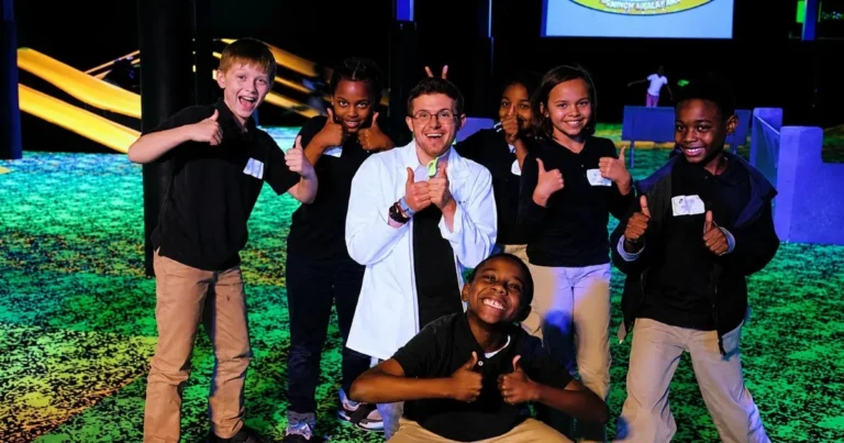 STEM Field trip group of kids and teacher posing with thumbs up for a photo at Fun Slides carpet skatepark and party center in Pittsburgh